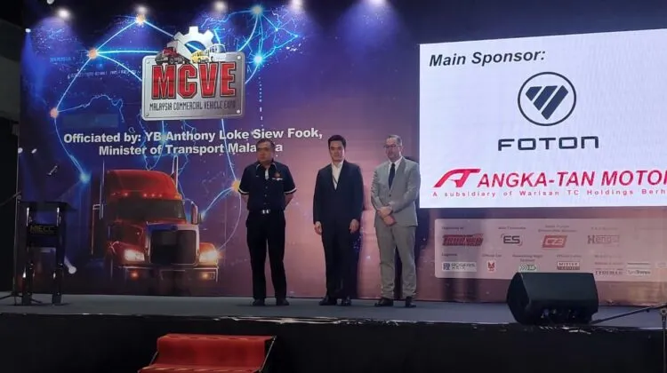 Transport Minister Anthony Loke with James Tan and Stefan Pertz at the main stage of MCVE 2026.